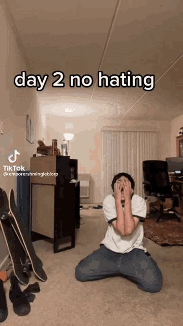 day 2 no hating gif with the guy wallowing in pain and screaming and crying 