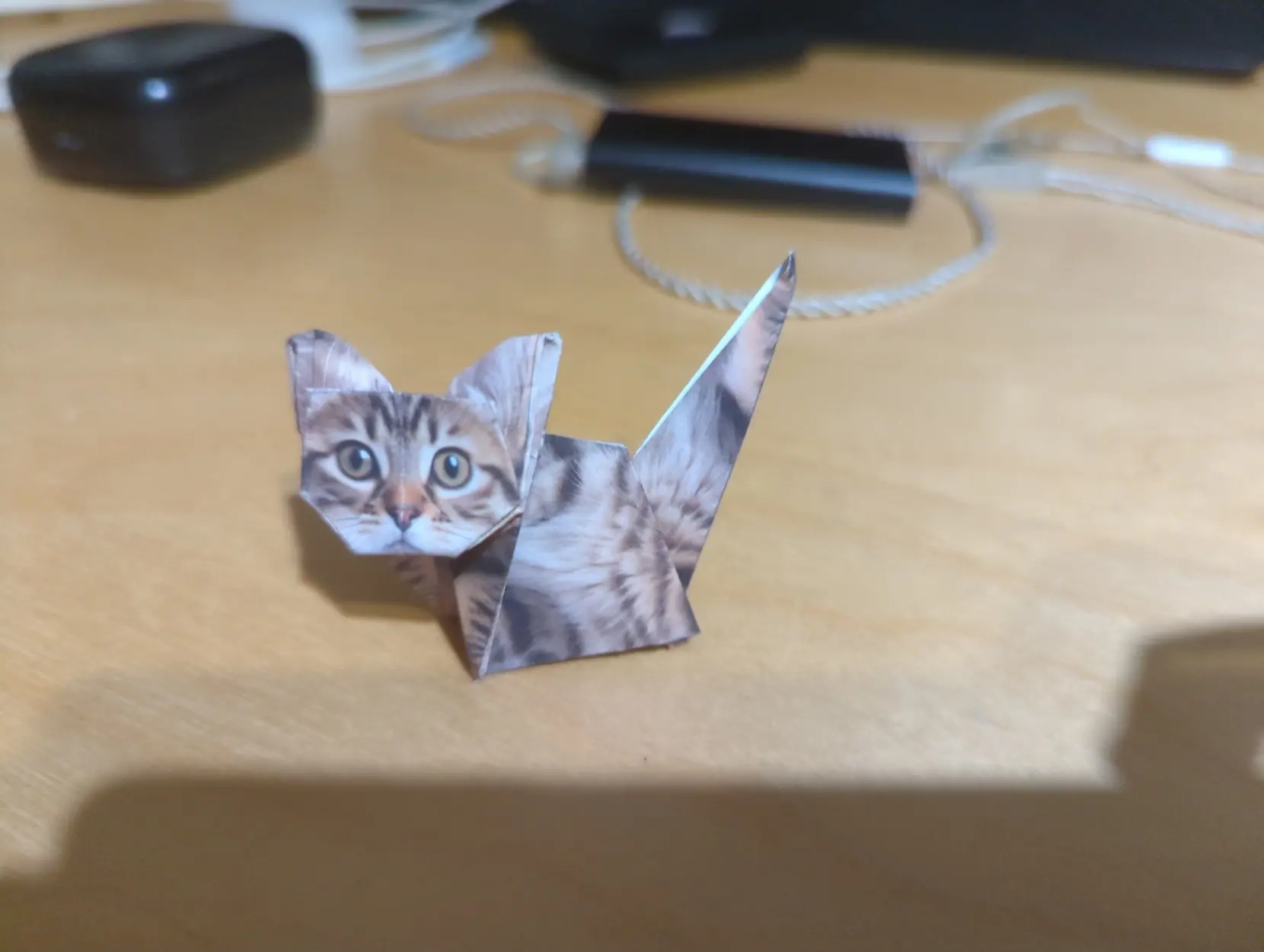 little cute origami cat with realistic features.