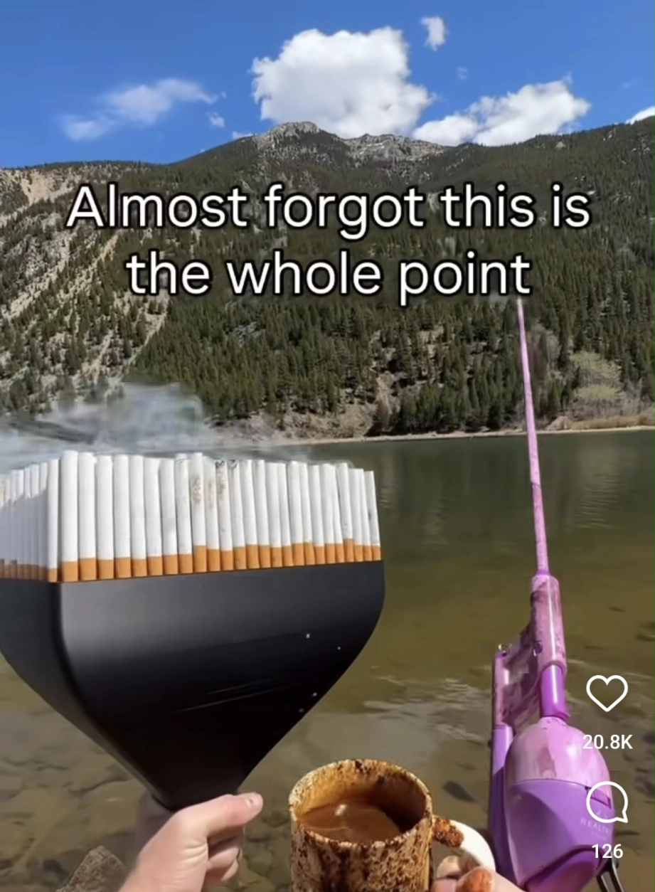 almost forgot this is the whole point and its a lake at a mountain range where a guy is smoking the 100 filter to 1 cigarette adapter, a pink fishing rod and a coffee thats been spilling over all the edges (in the video he was shaking as well)