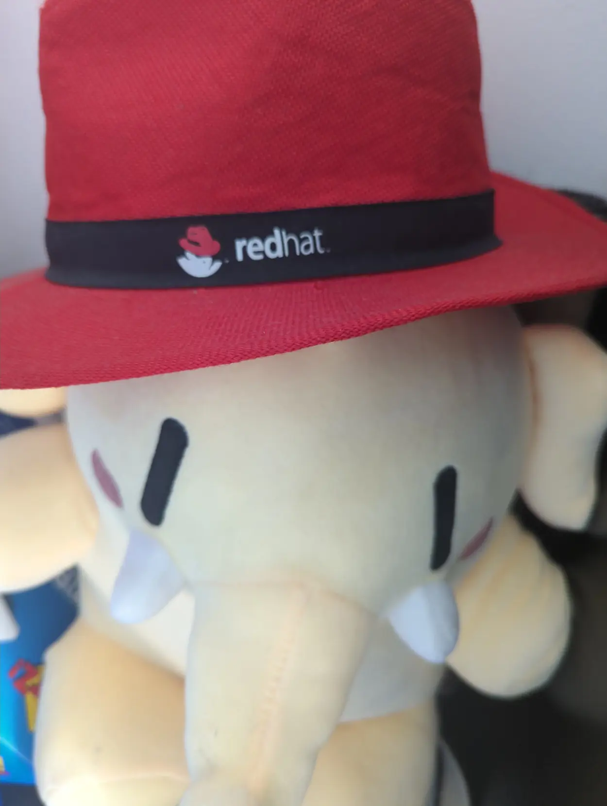 mastodon plushie wearing the redhat red hat