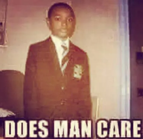 heavily edited picture of a kid in school uniform looking blankly at the camera with impact font that says "DOES MAN CARE"